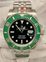 Black dial with green bezel and miyota